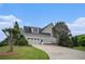 Exterior view showcasing the two-car garage and driveway at 639 Puckett Se Rd, Emerson, GA 30137