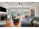 Bright living room with fireplace, French doors, and comfortable seating at 639 Puckett Se Rd, Emerson, GA 30137