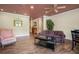 Comfortable living room with hardwood floors, ceiling fan, and cozy seating arrangement at 639 Puckett Se Rd, Emerson, GA 30137