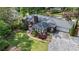 Aerial view of home showcasing the spacious lot, lush landscaping, and driveway at 10 Wyndham Dr, Sandy Springs, GA 30328
