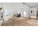 Spacious finished basement with light wood floors and white columns, providing a versatile living area at 10 Wyndham Dr, Sandy Springs, GA 30328