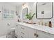 Modern bathroom with double vanity, marble countertop, and shiplap walls creating a bright, clean aesthetic at 10 Wyndham Dr, Atlanta, GA 30328