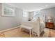 Bright bedroom with a white bed, white furniture, and natural light, creating a serene and relaxing space at 10 Wyndham Dr, Sandy Springs, GA 30328