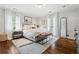 Comfortable bedroom with hardwood floors, stylish furnishings, and natural light at 10 Wyndham Dr, Sandy Springs, GA 30328
