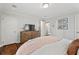 Bedroom with hardwood floors, a television, and neutral walls at 10 Wyndham Dr, Sandy Springs, GA 30328