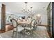 Spacious dining room with a large table, elegant chandelier, and seamless flow to the living area at 10 Wyndham Dr, Sandy Springs, GA 30328