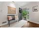 Inviting foyer with a bench, decorative map, and an open door leading to a view of the outdoors at 10 Wyndham Dr, Sandy Springs, GA 30328