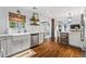 Kitchen featuring stainless steel appliances, white cabinets, and hardwood floors at 10 Wyndham Dr, Sandy Springs, GA 30328
