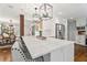 Bright, updated kitchen with an island, pendant lighting, white cabinets and stainless steel appliances at 10 Wyndham Dr, Atlanta, GA 30328