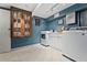 Well-organized laundry room with cabinetry, washer, dryer, and tiled floor at 10 Wyndham Dr, Sandy Springs, GA 30328