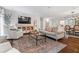 Spacious living room with modern decor, a large TV, and an inviting atmosphere for relaxation and entertainment at 10 Wyndham Dr, Sandy Springs, GA 30328