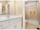 Bathroom with white cabinets and granite countertops with a tub/shower combo at 110 Apple Blossom Ln, Fayetteville, GA 30215