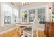 Cozy breakfast nook with natural light, charming decor and hardwood floors at 110 Apple Blossom Ln, Fayetteville, GA 30215