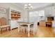 Bright dining area with hardwood floors, white furniture and natural light from the windows at 110 Apple Blossom Ln, Fayetteville, GA 30215