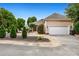 Beautiful home exterior with landscaping, paver walkway, and garage access at 110 Apple Blossom Ln, Fayetteville, GA 30215
