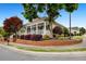 Charming home featuring a welcoming front porch, brick accents, and beautifully landscaped yard at 110 Apple Blossom Ln, Fayetteville, GA 30215