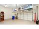 Garage space with storage racks, shelves and a functional garage door at 110 Apple Blossom Ln, Fayetteville, GA 30215