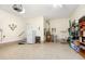 Spacious garage with a white refrigerator, sink, storage shelves, and epoxy floors at 110 Apple Blossom Ln, Fayetteville, GA 30215