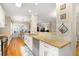 Open kitchen with granite countertops, stainless steel appliances and hardwood floors at 110 Apple Blossom Ln, Fayetteville, GA 30215