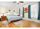 Serene bedroom with hardwood floors, plenty of natural light, and tasteful decor at 110 Apple Blossom Ln, Fayetteville, GA 30215