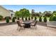 Paver patio with outdoor seating, ideal for entertaining and enjoying the landscaped yard at 110 Apple Blossom Ln, Fayetteville, GA 30215