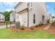 Landscaped backyard featuring green grass and a stone path at 146 Birch Tree Way, Cumming, GA 30040