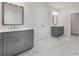 Bathroom with gray vanities, modern fixtures, and marble-patterned tile floors at 146 Birch Tree Way, Cumming, GA 30040