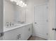 Stylish bathroom with double vanity, modern lighting, and neutral color palette at 146 Birch Tree Way, Cumming, GA 30040