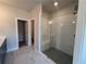 Walk-in shower with tile surround, bench seating, and dual shower heads at 146 Birch Tree Way, Cumming, GA 30040