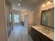 Bathroom with marble floor tiles, a walk-in glass shower and double sink vanity at 146 Birch Tree Way, Cumming, GA 30040