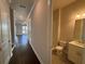 Hallway view of a bathroom with a glass shower and a white vanity at 146 Birch Tree Way, Cumming, GA 30040