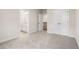 Bright bedroom with carpet flooring, featuring an ensuite bath and closet at 146 Birch Tree Way, Cumming, GA 30040