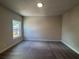 Bedroom with plush carpet, recessed lighting, neutral colored walls, and a window at 146 Birch Tree Way, Cumming, GA 30040
