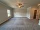 Bedroom with neutral tones, carpet, natural light, and a ceiling fan at 146 Birch Tree Way, Cumming, GA 30040