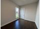 Minimalist bedroom with hardwood floors, a window, and white trim at 146 Birch Tree Way, Cumming, GA 30040