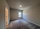 Bright bedroom featuring plush carpet, recessed lighting, neutral colored walls, and white trim at 146 Birch Tree Way, Cumming, GA 30040