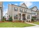 Elegant brick home with a covered entryway, showcasing its well-maintained landscaping and curb appeal at 146 Birch Tree Way, Cumming, GA 30040