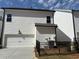 Exterior view of the house with the garage at 146 Birch Tree Way, Cumming, GA 30040