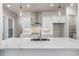 Stylish kitchen with quartz countertops, stainless steel hood, and pendant lighting at 146 Birch Tree Way, Cumming, GA 30040