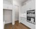 Kitchen features modern appliances and a pantry at 146 Birch Tree Way, Cumming, GA 30040
