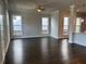 Open-concept living area features hardwood floors, lots of windows, and natural light at 146 Birch Tree Way, Cumming, GA 30040