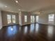Bright and airy living room with hardwood floors, neutral walls, and ample natural light at 146 Birch Tree Way, Cumming, GA 30040