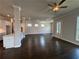 Open living space featuring hardwood floors, white trim, and modern lighting at 146 Birch Tree Way, Cumming, GA 30040