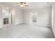 Spacious main bedroom with carpeted floors, a ceiling fan, and access to the bathroom at 146 Birch Tree Way, Cumming, GA 30040