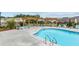 Community pool with lounge seating and shaded area, perfect for relaxing at 146 Birch Tree Way, Cumming, GA 30040