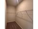 Walk-in closet featuring metal shelving, and carpeted floors at 146 Birch Tree Way, Cumming, GA 30040