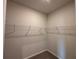 Spacious walk-in closet featuring metal shelving and carpeted floors at 146 Birch Tree Way, Cumming, GA 30040