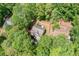 An aerial view showcasing a beautiful tree-surrounded home with a well-maintained landscape at 160 Wentworth Dr, Canton, GA 30114