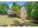 Exterior of a two story home featuring large backyard, deck, and lush green surroundings at 160 Wentworth Dr, Canton, GA 30114