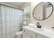 Bright bathroom featuring a vanity with solid surface countertops, with a tub and shower combination at 160 Wentworth Dr, Canton, GA 30114
